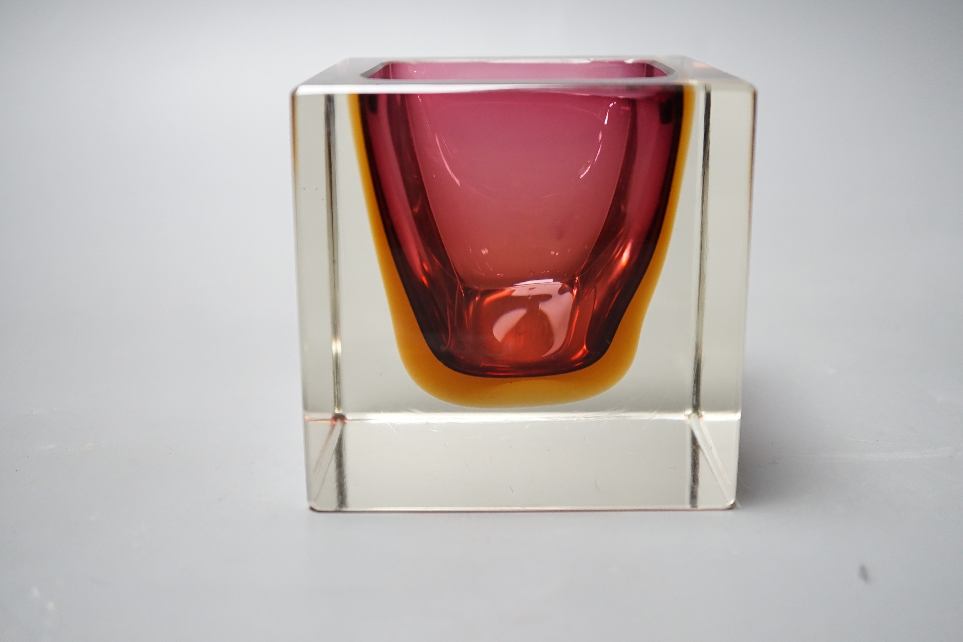 A Murano red, amber and clear cased glass cube vase, 9.5cm tall